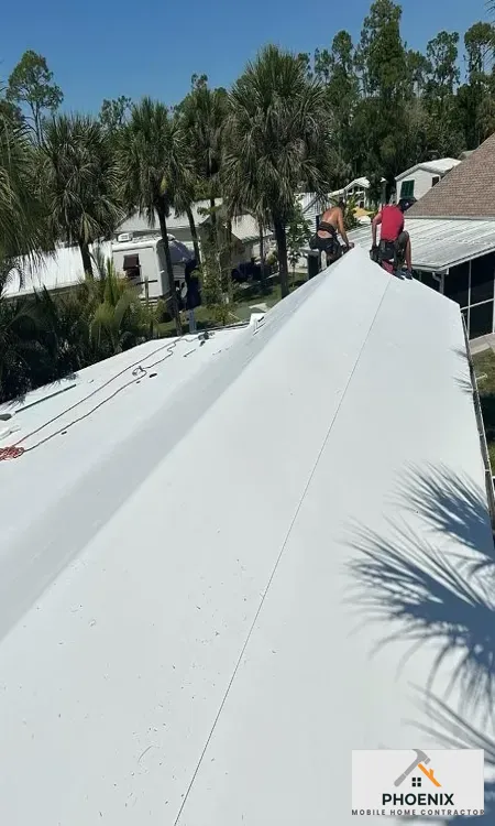 Professional Mobile Home Roof Installation Seamless white roof coating installation on manufactured home to increase energy efficiency in Arizona