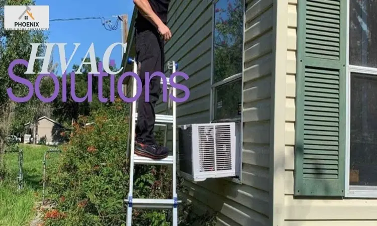 Technician servicing window AC unit on a mobile home in Phoenix, Arizona as part of HVAC repair and cooling solutions